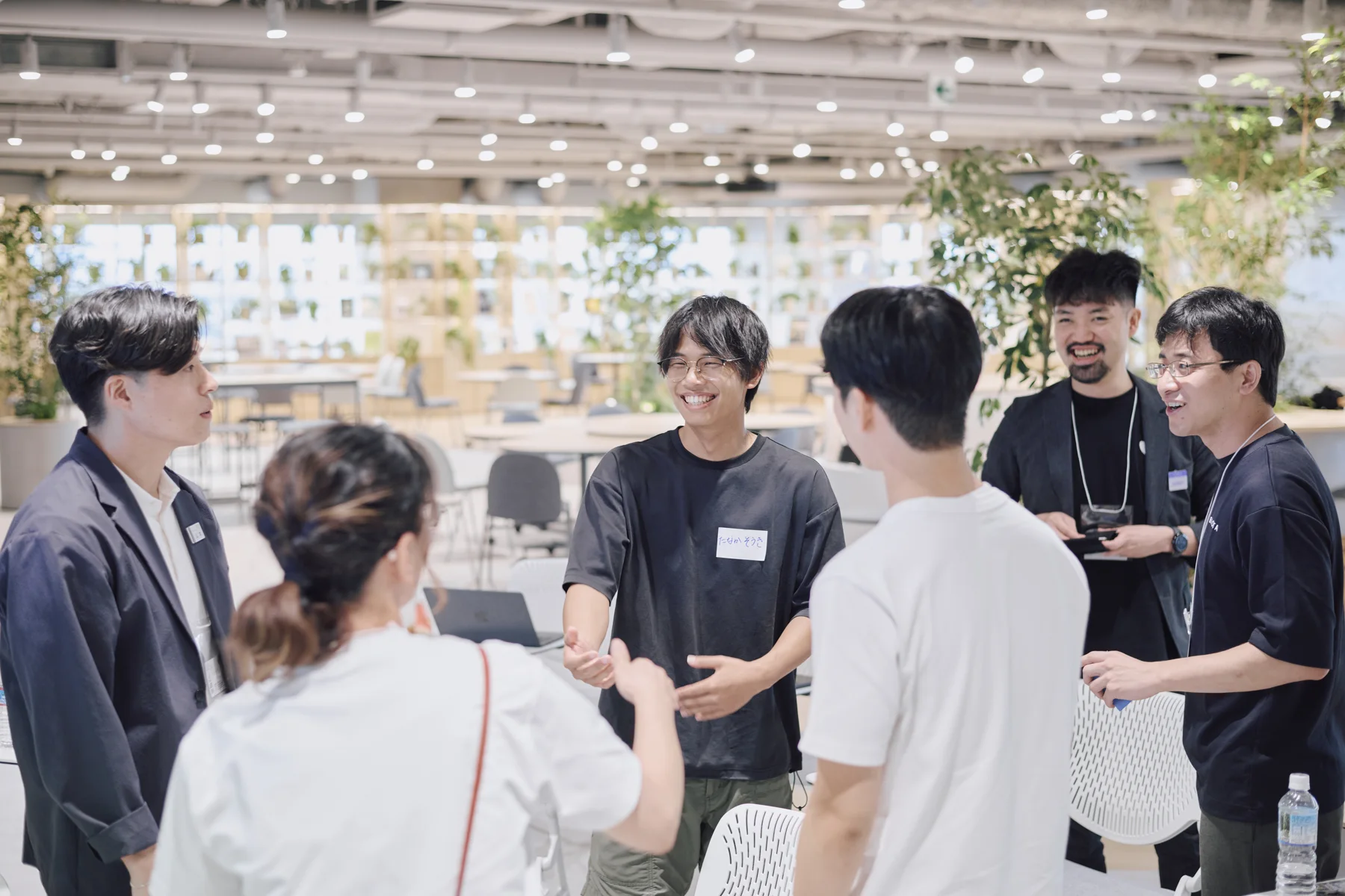 Check-in: participants and people from the companies introducing themselves, standing